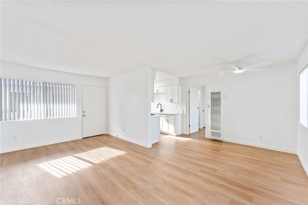 221 10th Street Huntington Beach, CA 92648 - Photo 8 of 20 a view of empty room with wooden floor