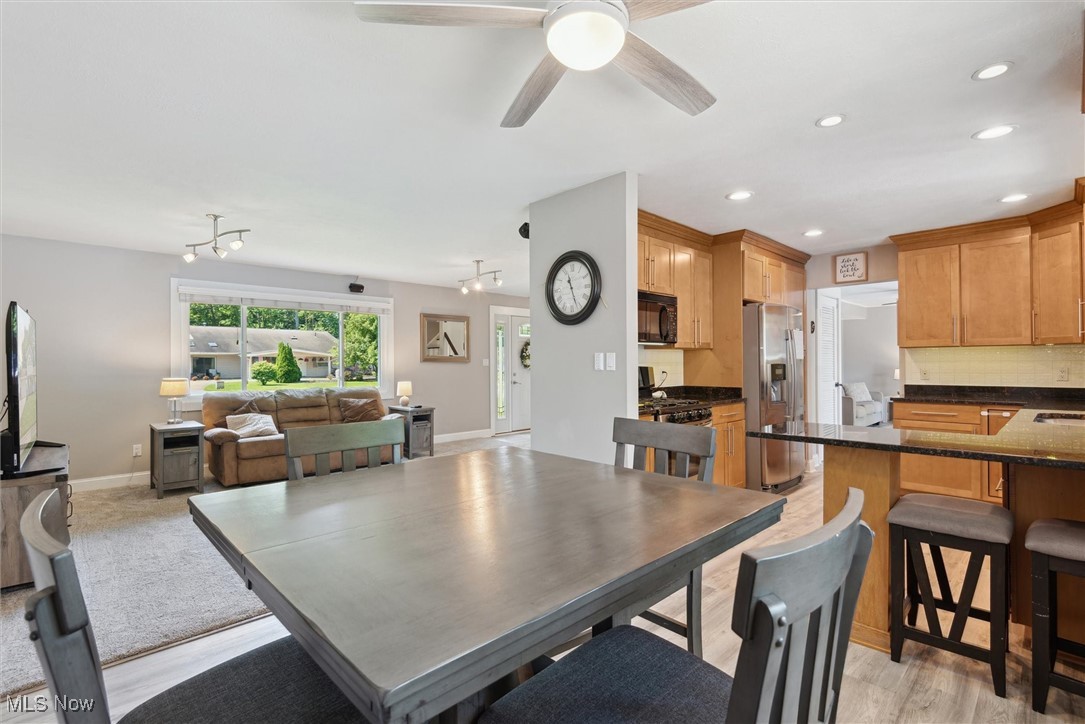 8191 Edgewood Road Mentor, OH 44060 - Photo 12 of 44 Charming dining space with modern flooring and a view of the backyard retreat—ideal for everyday meals and entertaining