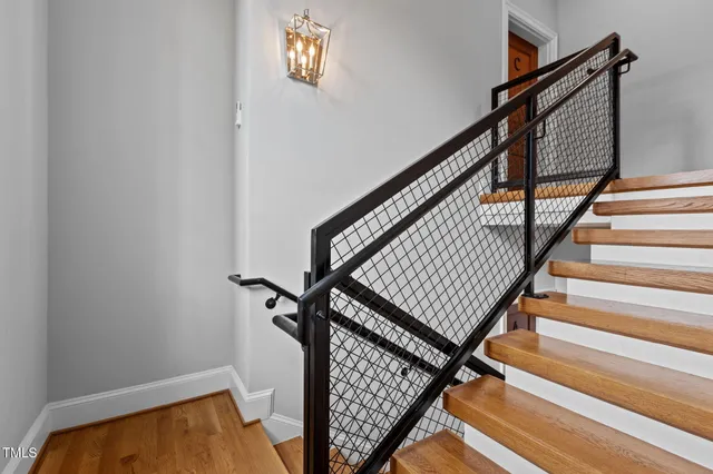 a view of a balcony with wooden floor and fence and a floor to ceiling window