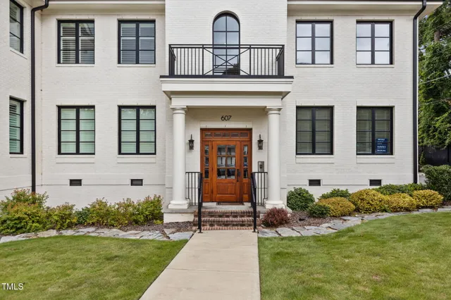 a front view of a house with glass windows