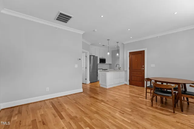 a view of kitchen with wooden floor