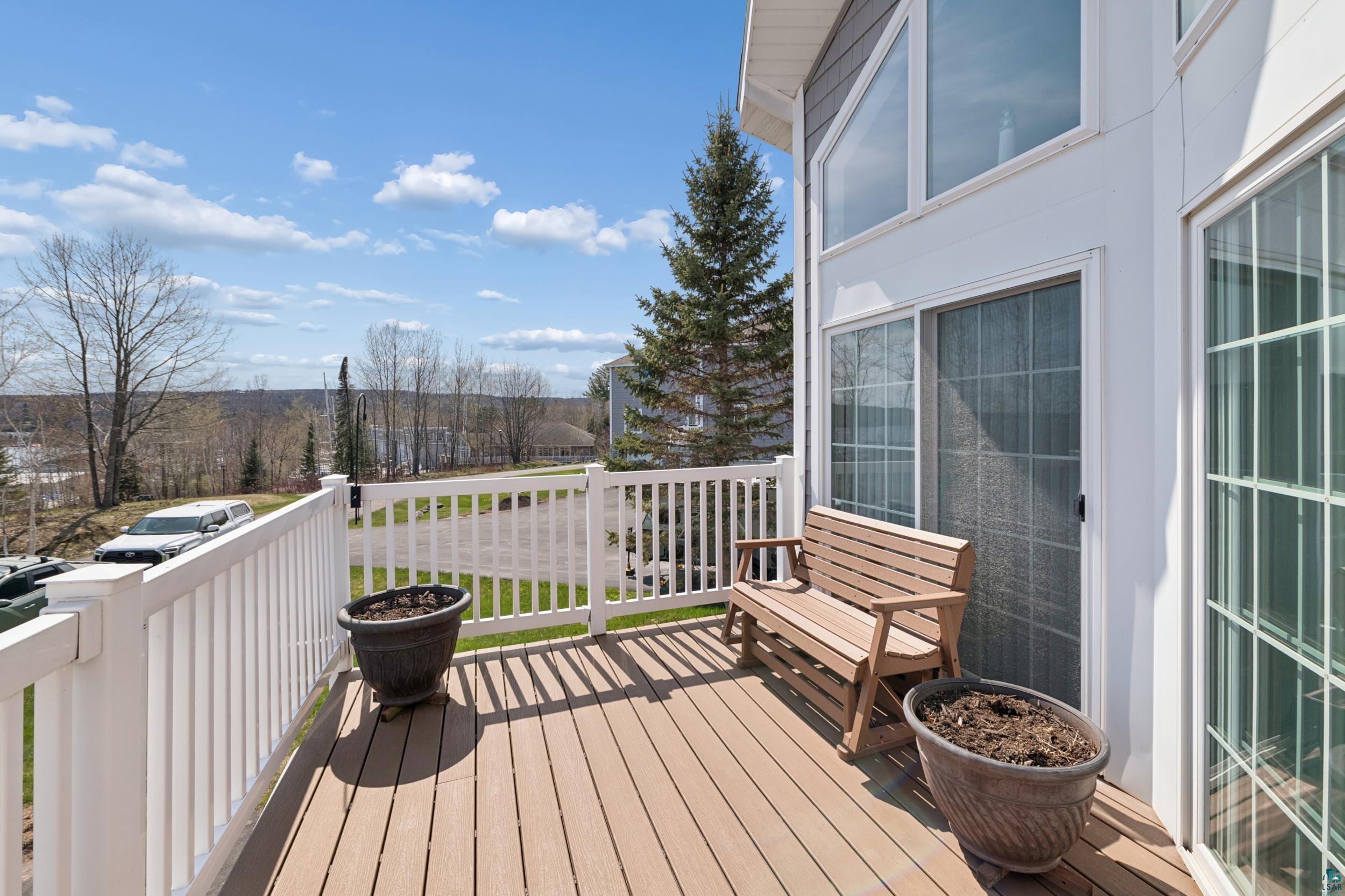 34590 Bay View Road, Unit 801 Bayfield, WI 54814 - Photo 3 of 36 Expansive outdoor deck featuring wood-finish flooring and white railings