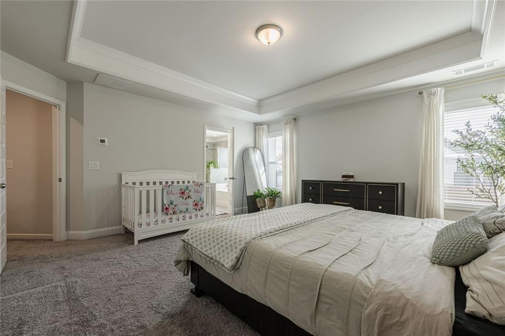 3593 Dover Run Lane Loganville, GA 30052 - Photo 29 of 54 a bedroom with a bed and a window