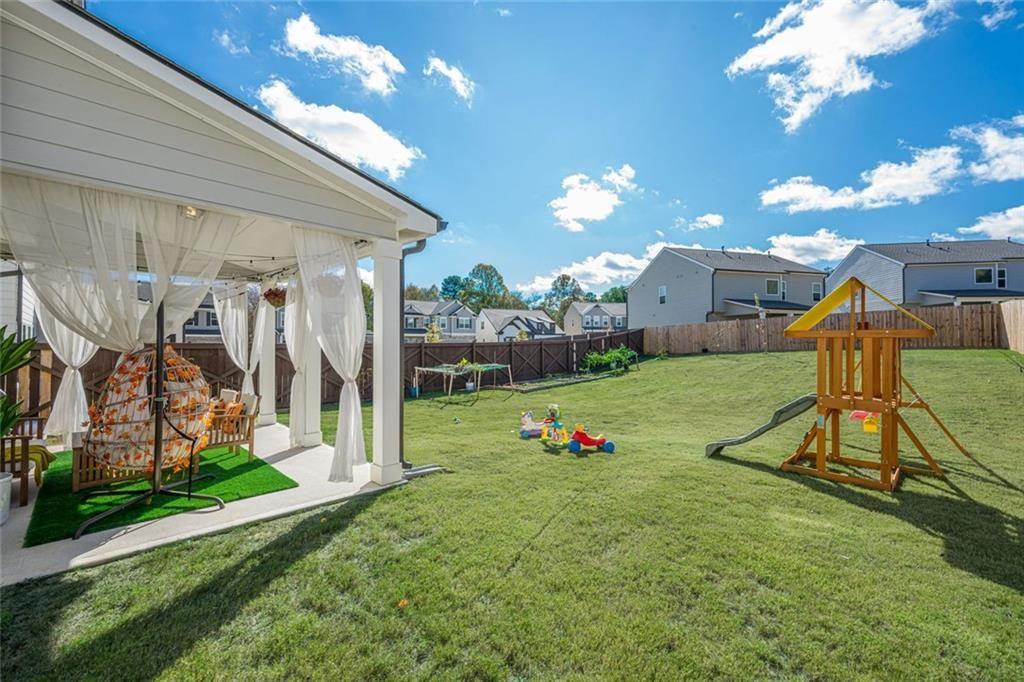 3593 Dover Run Lane Loganville, GA 30052 - Photo 49 of 54 a view of a backyard with a slide