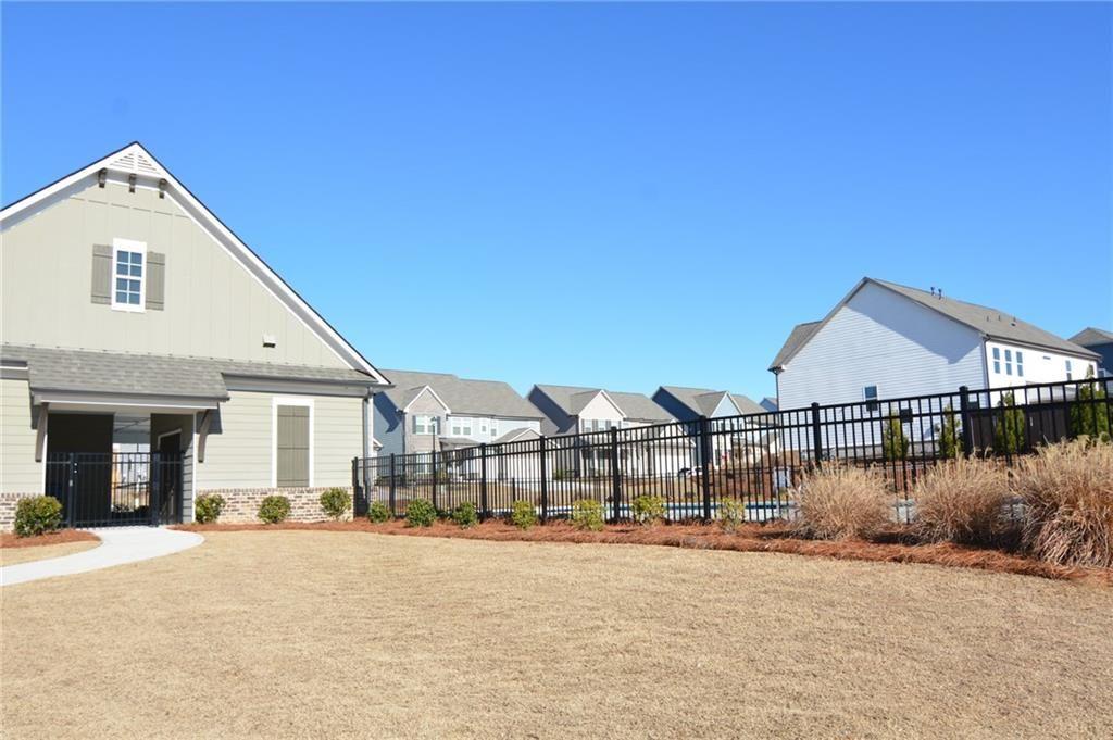 3593 Dover Run Lane Loganville, GA 30052 - Photo 54 of 54 a front view of a house with a yard and garage