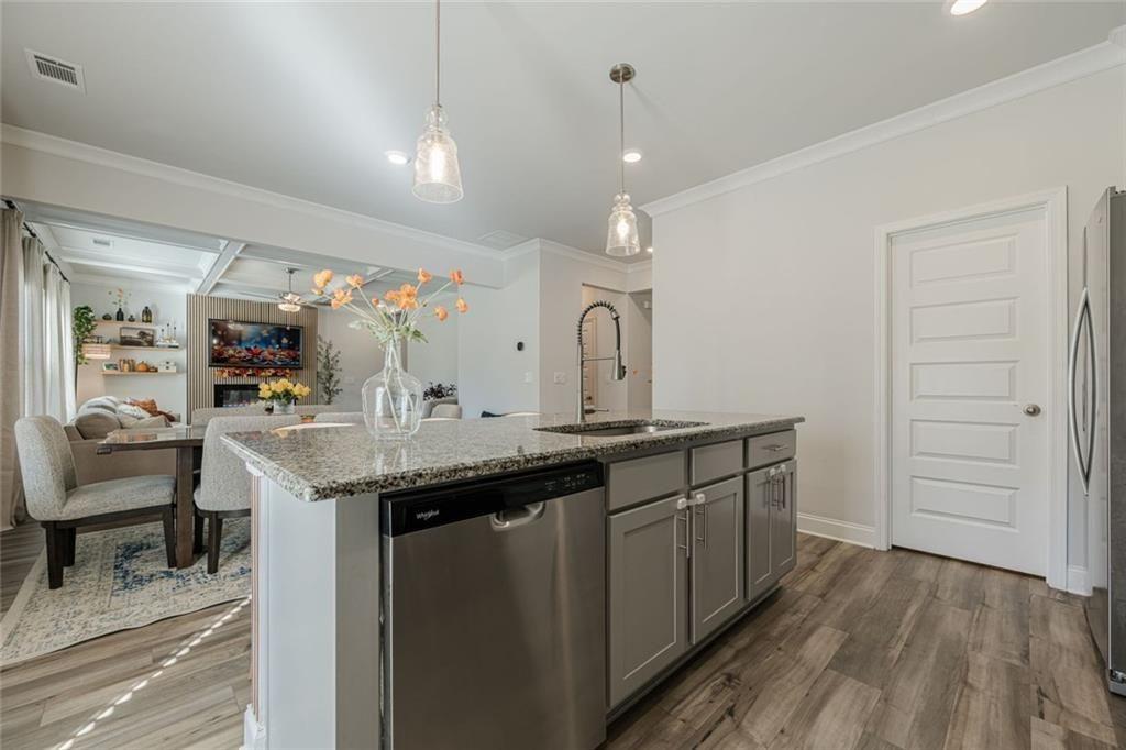 3593 Dover Run Lane Loganville, GA 30052 - Photo 8 of 54 a kitchen with center island and sink
