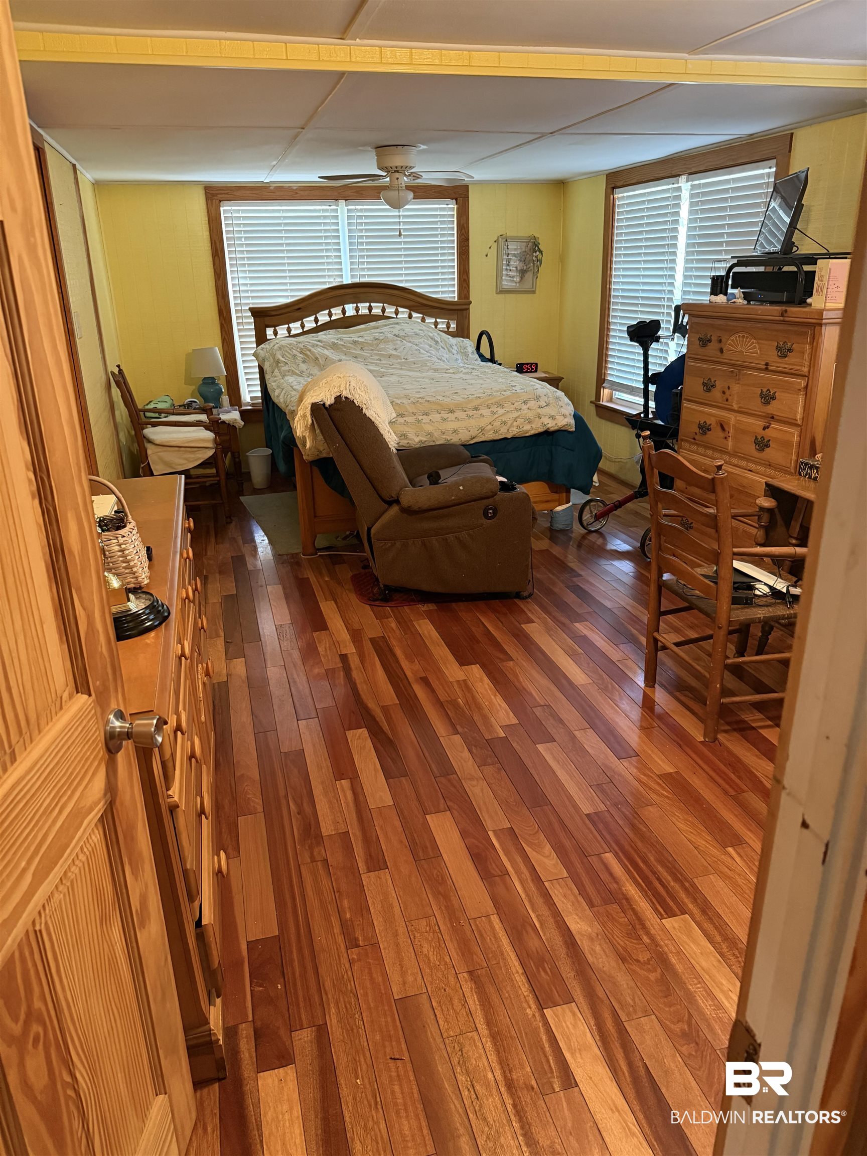12990 Groves Road Summerdale, AL 36580 - Photo 4 of 8 Bedroom with wood finished floors