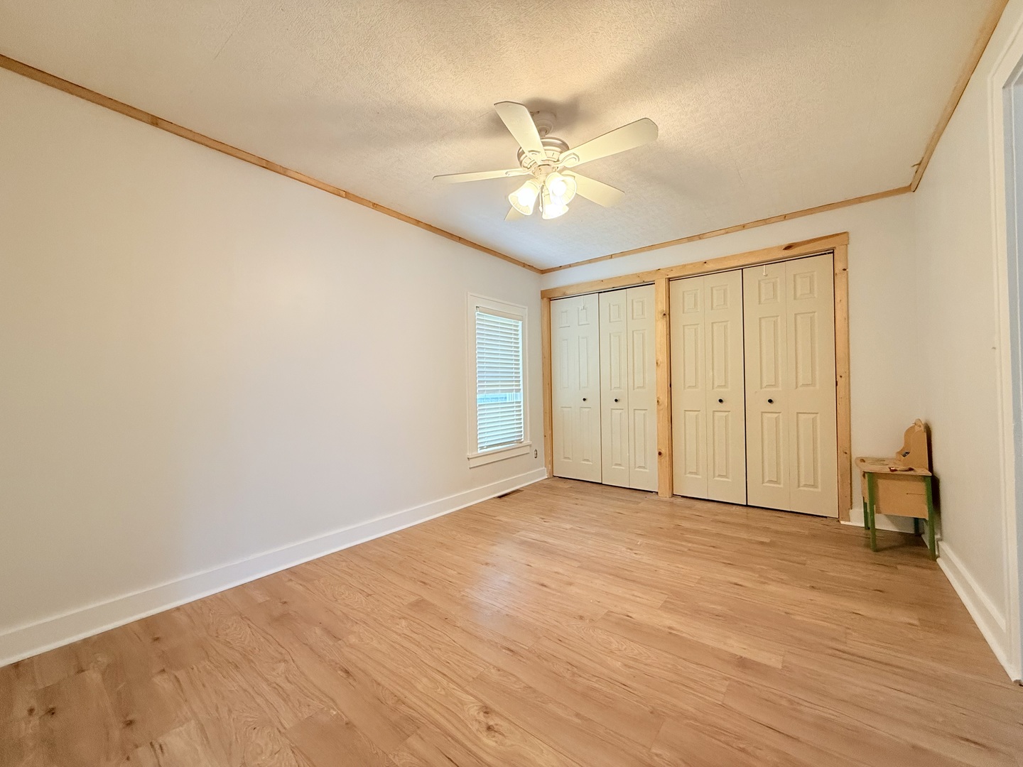 90 Pickering Road Harrisburg, IL 62946 - Photo 10 of 15 a view of an empty room with wooden floor and a window
