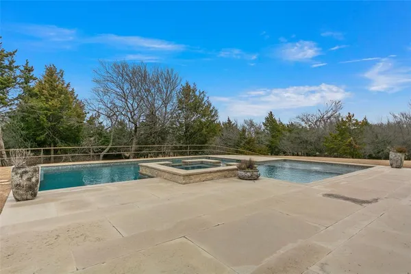a view of swimming pool with a yard