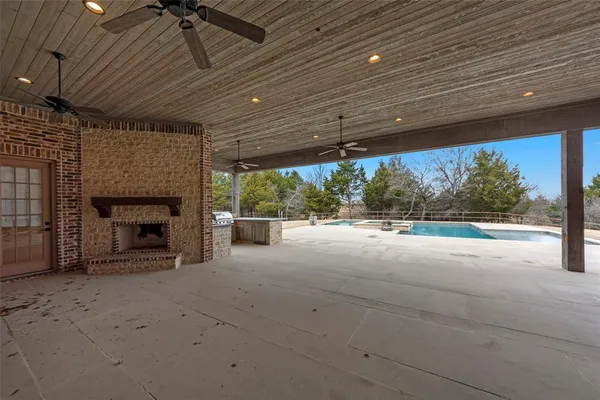 a view of an empty room with a fireplace
