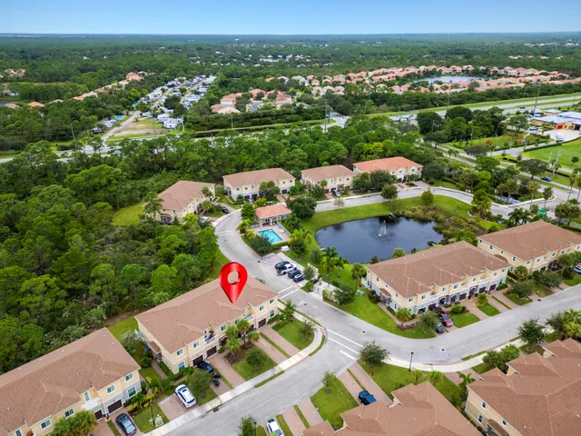 an aerial view of residential houses with outdoor space