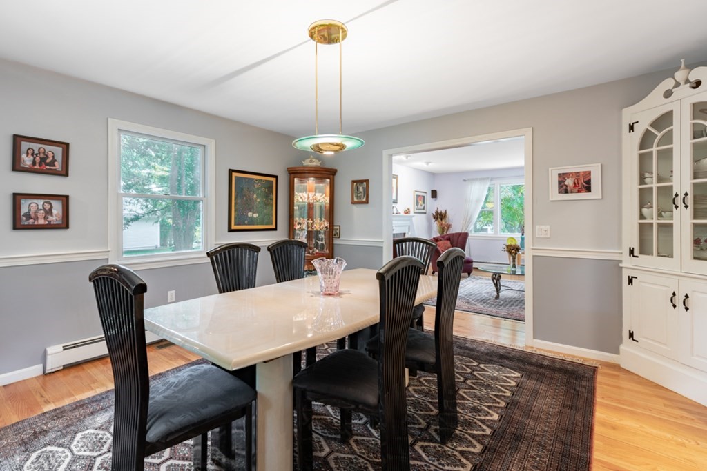 21 Longacre Road Needham, MA 02492 - Photo 11 of 41 a view of a dining room with furniture window and wooden floor