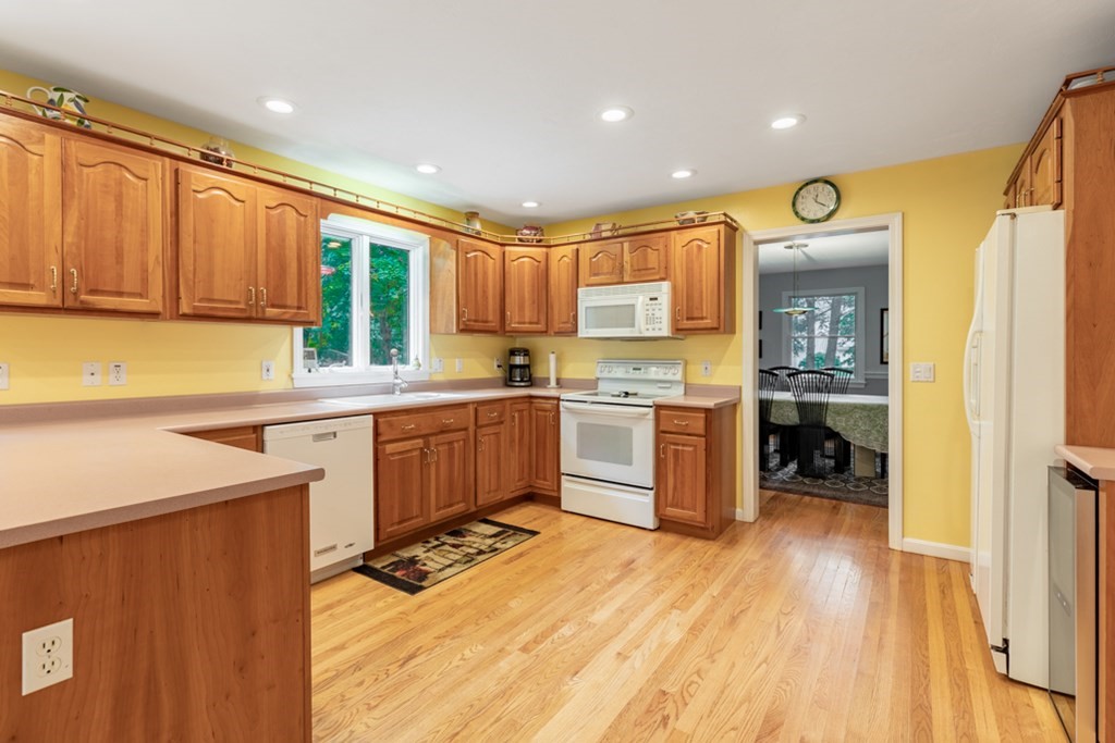 21 Longacre Road Needham, MA 02492 - Photo 15 of 41 a kitchen with a sink a counter top space stainless steel appliances and cabinets