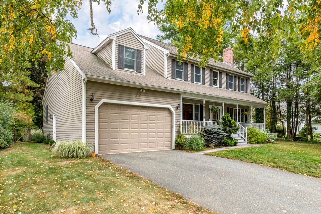 21 Longacre Road Needham, MA 02492 - Photo 2 of 41 a front view of a house with a yard and garage