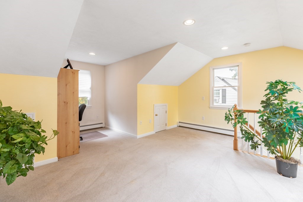 21 Longacre Road Needham, MA 02492 - Photo 21 of 41 an empty room with windows and flower plants