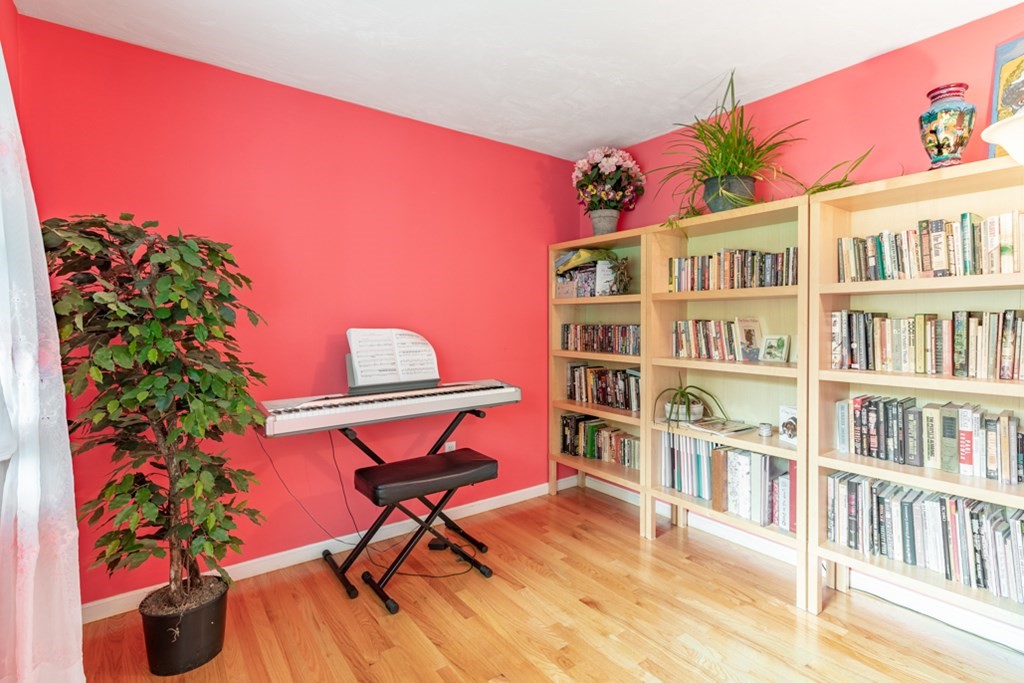 21 Longacre Road Needham, MA 02492 - Photo 22 of 41 a living room with furniture and a book shelf