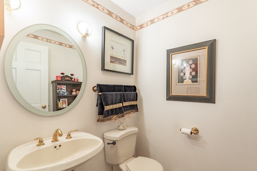 21 Longacre Road Needham, MA 02492 - Photo 24 of 41 a bathroom with a toilet a sink and a mirror