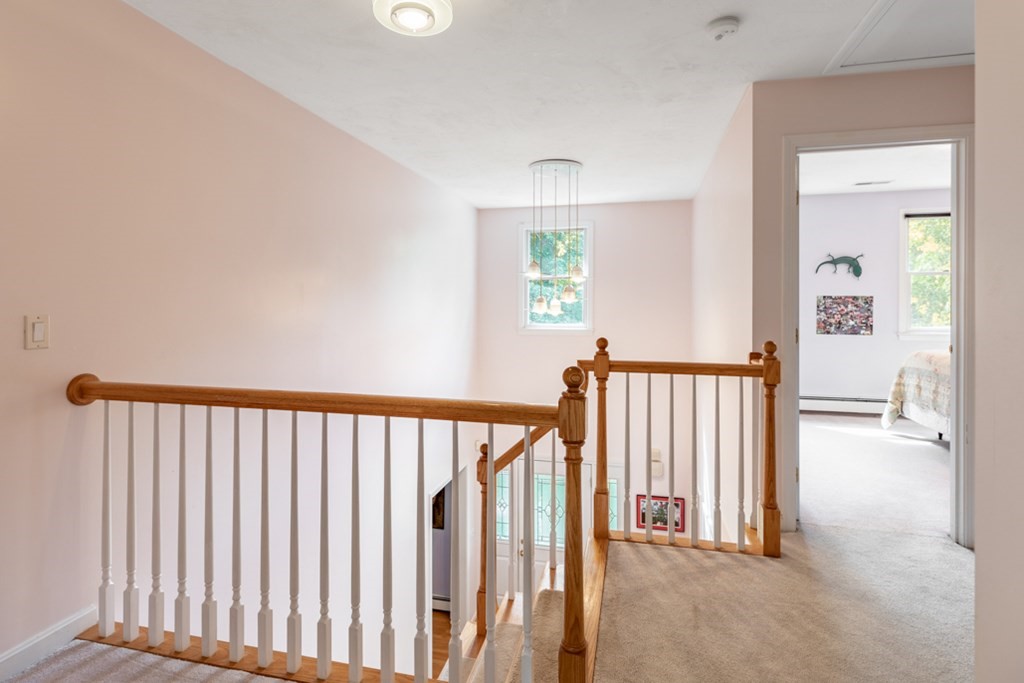 21 Longacre Road Needham, MA 02492 - Photo 25 of 41 a view of a hallway with wooden floor and windows