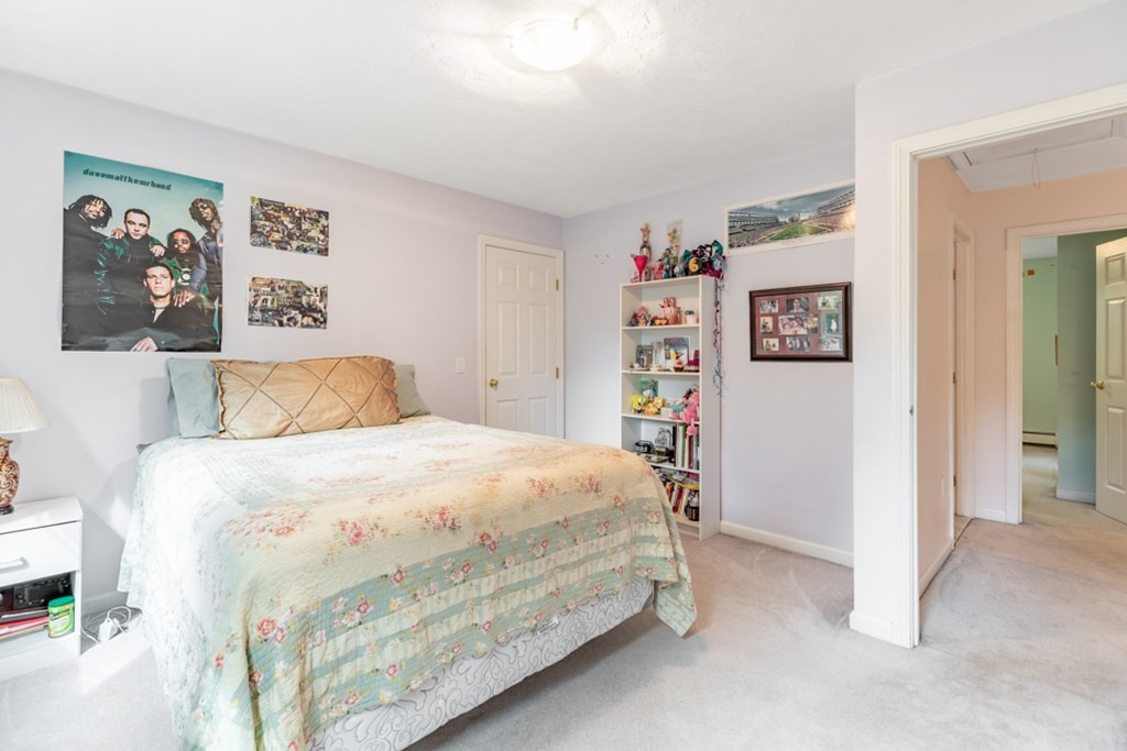 21 Longacre Road Needham, MA 02492 - Photo 27 of 41 a bedroom with a bed and painting on the wall
