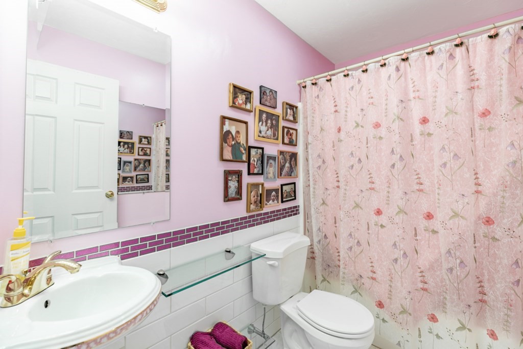 21 Longacre Road Needham, MA 02492 - Photo 35 of 41 a bathroom with a toilet sink and mirror