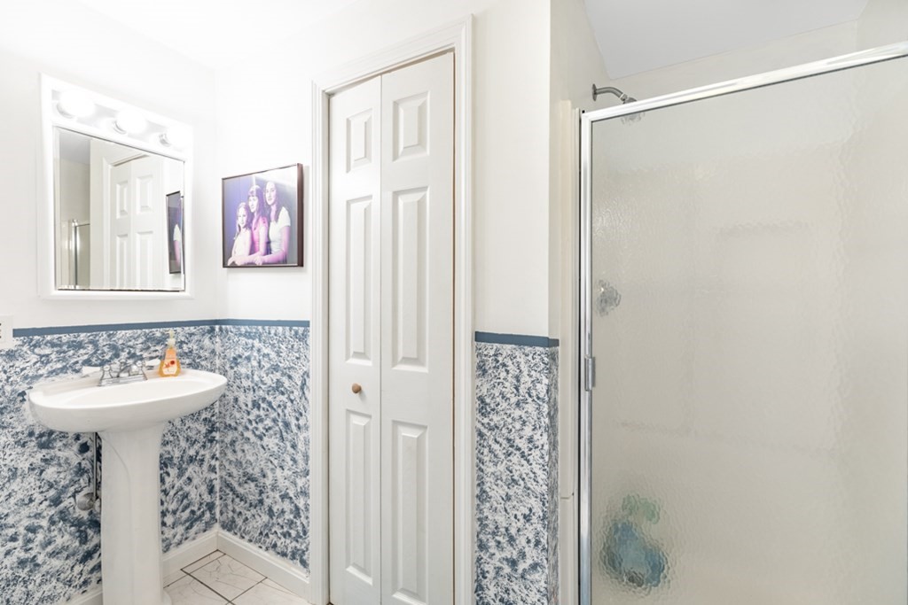 21 Longacre Road Needham, MA 02492 - Photo 39 of 41 a bathroom with a sink and a mirror
