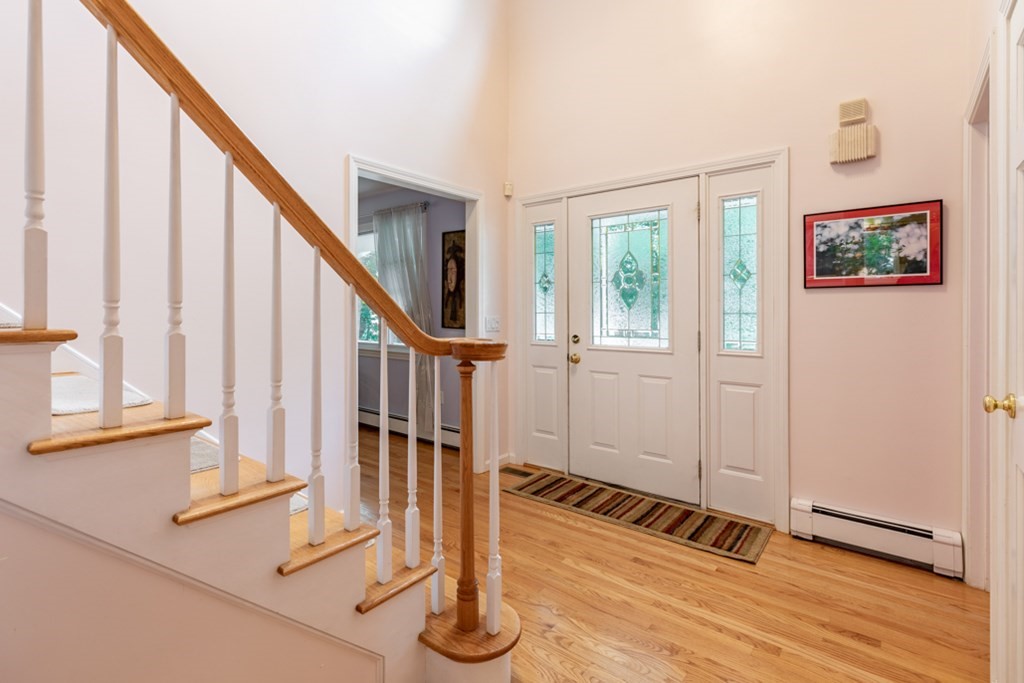 21 Longacre Road Needham, MA 02492 - Photo 6 of 41 a view of an entryway with wooden floor and door
