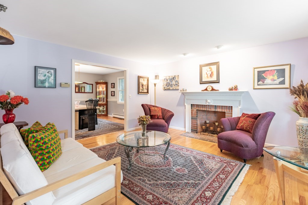 21 Longacre Road Needham, MA 02492 - Photo 7 of 41 a living room with furniture and a fireplace