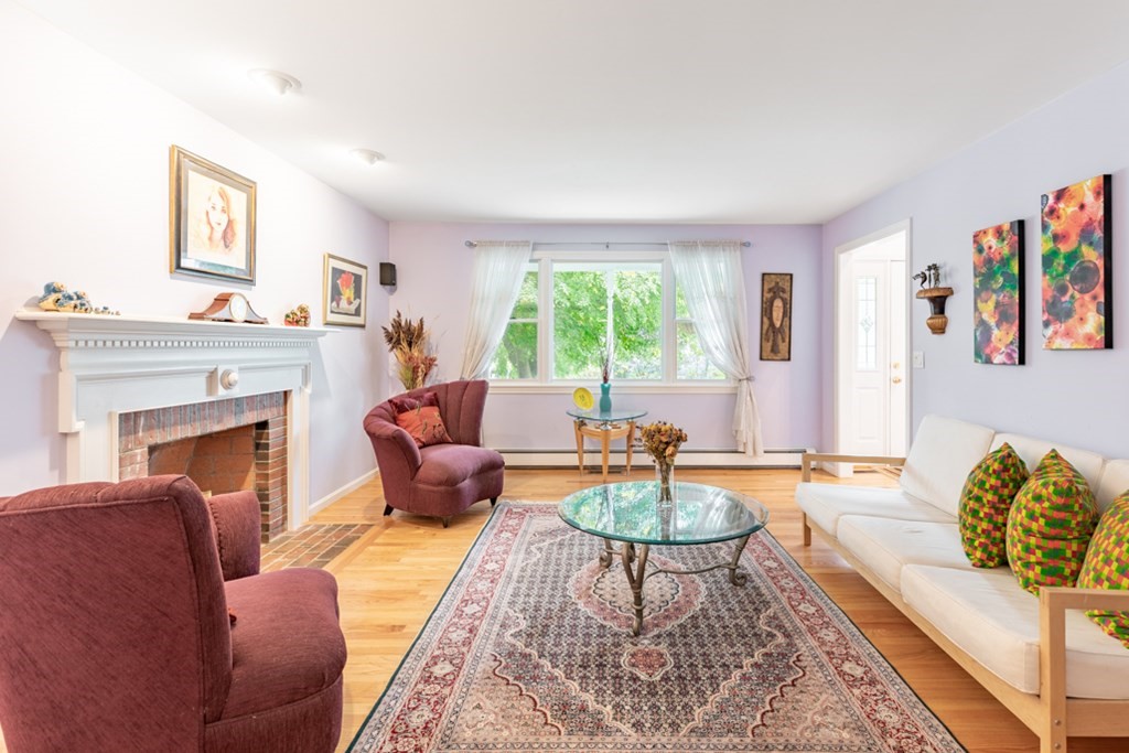 21 Longacre Road Needham, MA 02492 - Photo 8 of 41 a living room with furniture and a fireplace