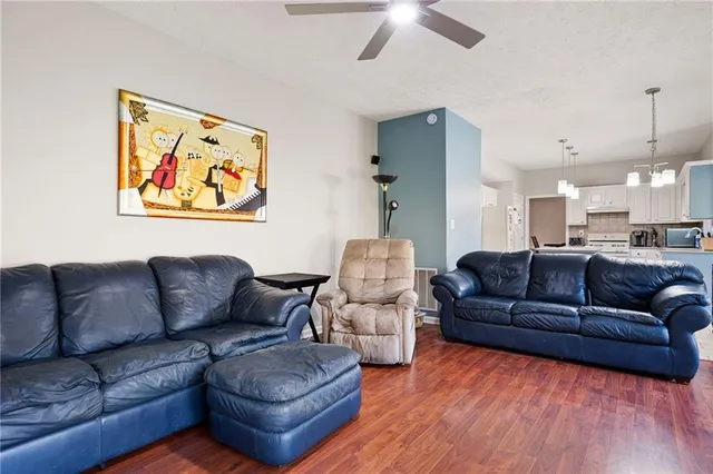 a kitchen with a stove a sink and a refrigerator