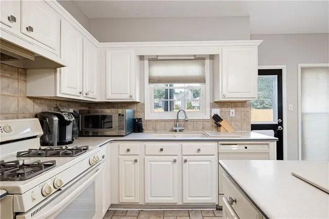 a bedroom with a bed dresser and a window