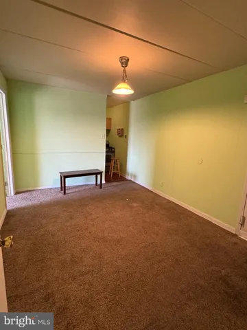 a view of a room with a hanging light