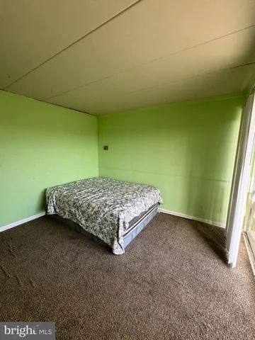 a view of a balcony with wooden floor
