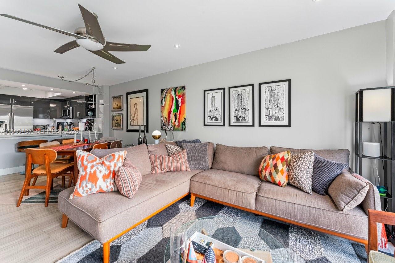 1450 Lincoln Road, Unit 307 Miami Beach, FL 33139 - Photo 3 of 18 a living room with furniture ceiling fan and a rug