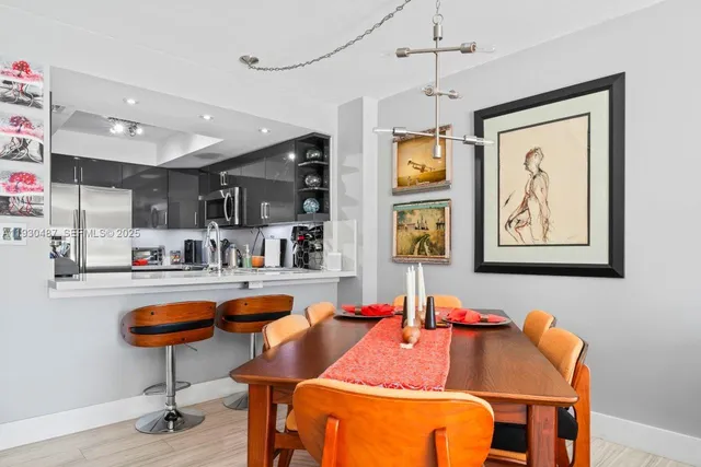 a outdoor dining space with furniture and kitchen view