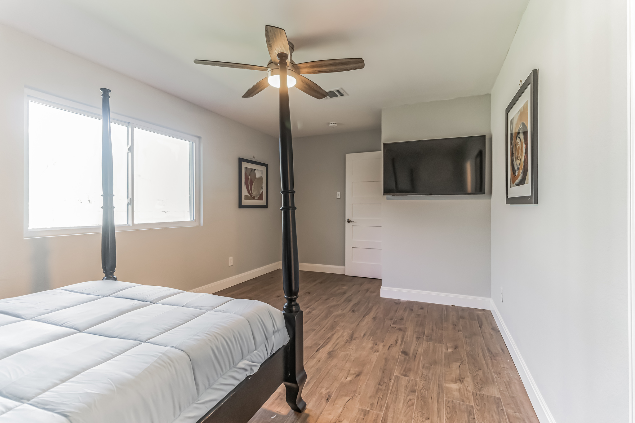 11406 Ruffed Grouse Drive Austin, TX 78758 - Photo 15 of 22 Warm wood flooring and clean white baseboards define this peaceful sleeping space.