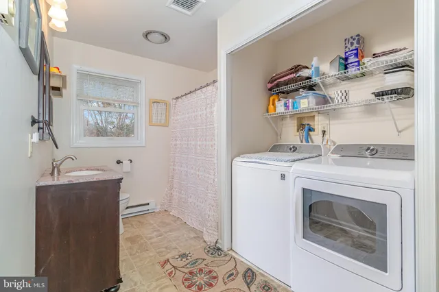 a utility room with dryer and washer