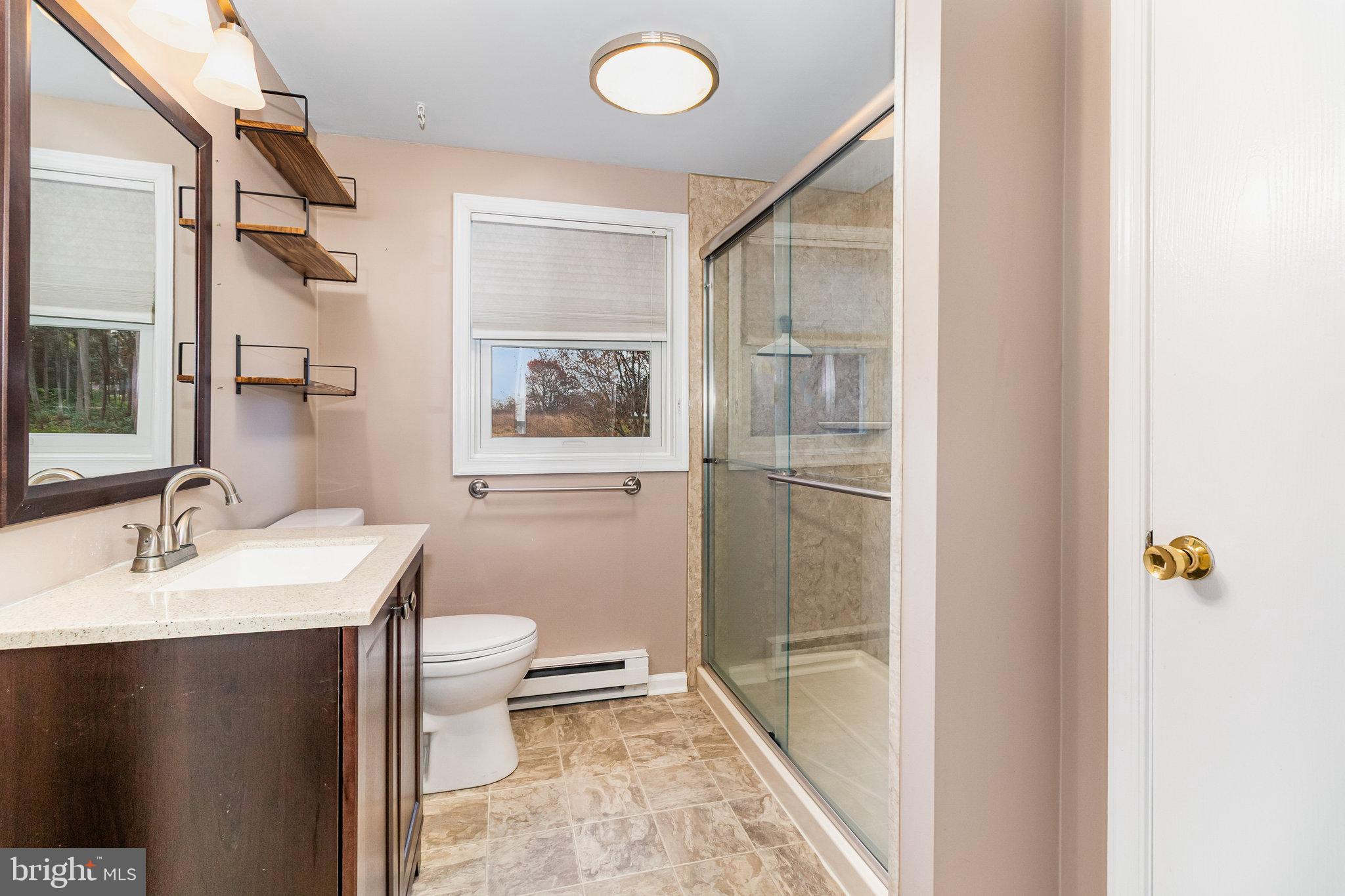 545 Wood View Drive Lititz, PA 17543 - Photo 19 of 38 a bathroom with a sink toilet and shower