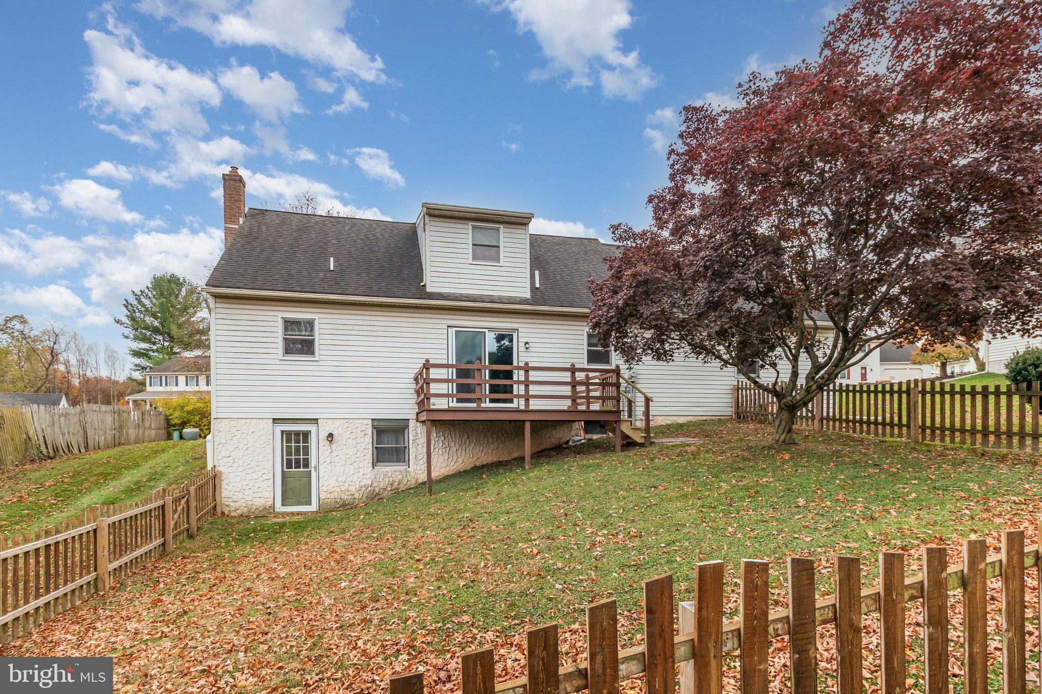 545 Wood View Drive Lititz, PA 17543 - Photo 29 of 38 a view of a chairs and a table in the backyard of a house