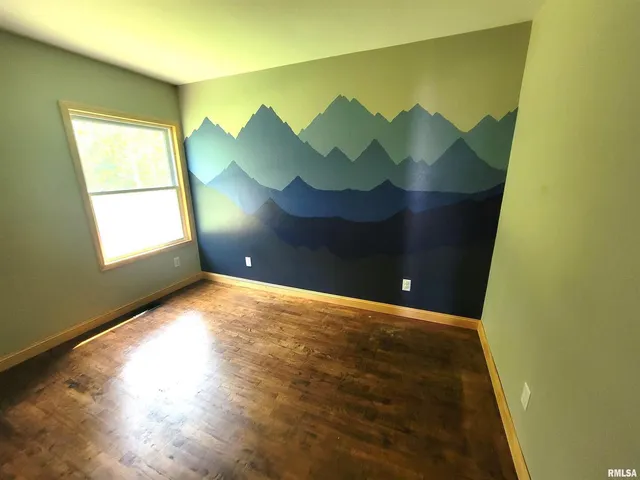 a bathroom with a granite countertop toilet a sink and a mirror