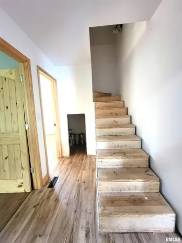 a view of a livingroom with hardwood floor and a window