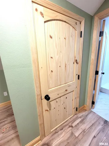 a view of a backyard with table and chairs and a grill