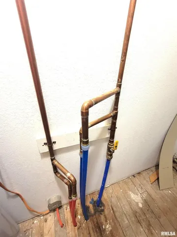 a bathroom with a toilet and a shower curtain