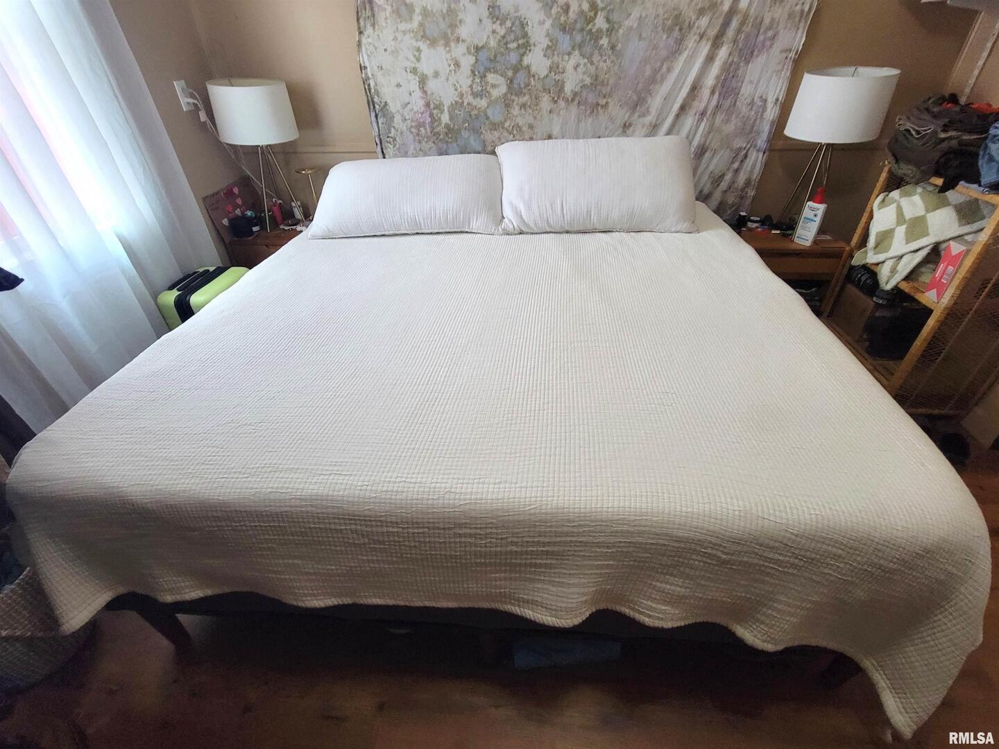 7324 State Rte 161 Extension Iuka, IL 62849 - Photo 69 of 78 a bed sitting in a bedroom next to a lamp