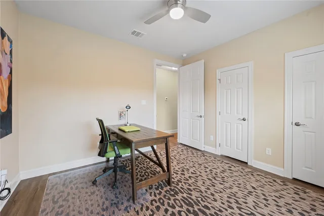 a workspace with furniture and wooden floor