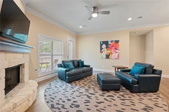 a living room with furniture and a fireplace
