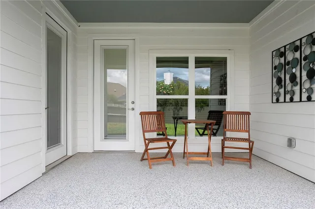 a view of living room with furniture and floor to ceiling window