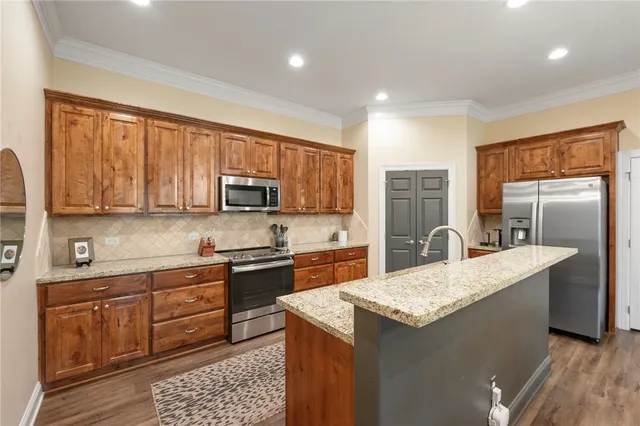a kitchen with a sink stove and refrigerator