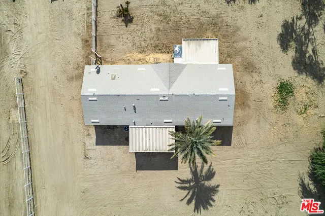 a living room with furniture a clock and a window