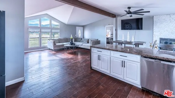 a bathroom with a granite countertop sink mirror and