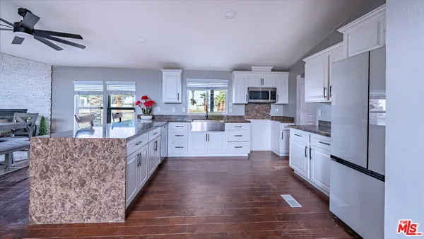 a bathroom with a granite countertop sink mirror and double